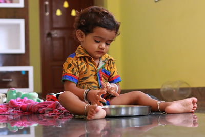 A child looking at food in a plate