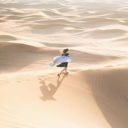 Full length of man on sand at beach