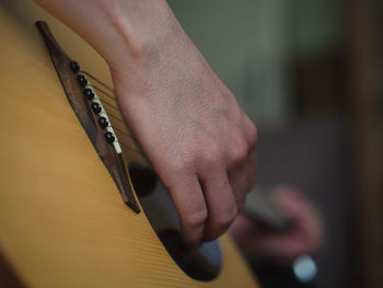 Close-up of man holding hands