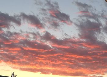 Low angle view of dramatic sky during sunset