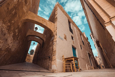 Low angle view of old building against sky