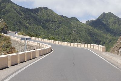 View of bridge leading towards mountains