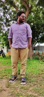 Young man standing on field