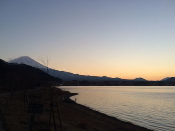 Scenic view of lake at sunset