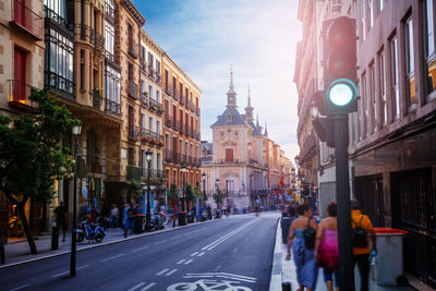 People walking on street in city