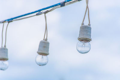 Hanging light bulb and beautiful blue sky.