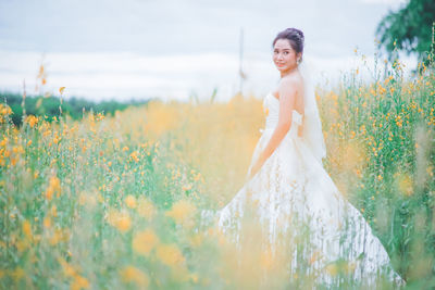 Woman standing on field