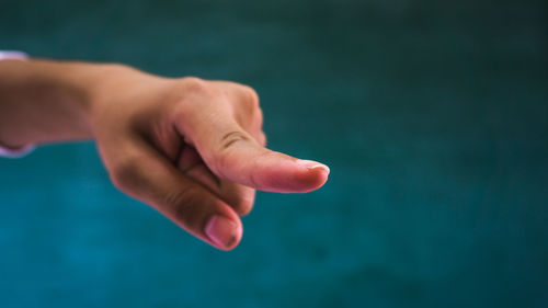 Close-up of hand against blurred background