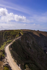 Scenic view of road amidst landscape against sky