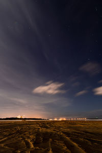 Scenic view of a beach landscape against sky at night