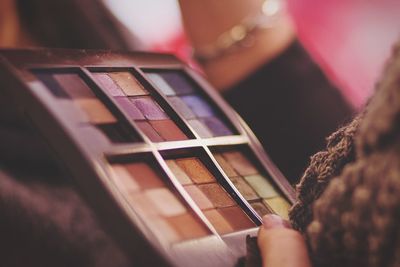 Woman holding makeup utensils