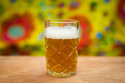 Close-up of beer glass on table