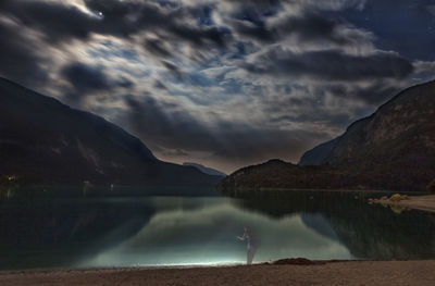 Scenic view of lake and mountains against sky