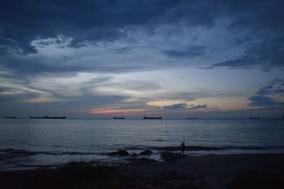 Scenic view of sea against sky at sunset