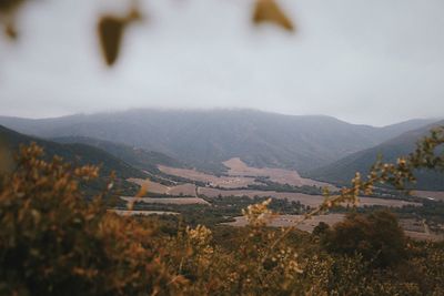 Scenic view of landscape and mountains against sky