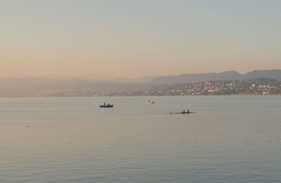 Scenic view of sea against clear sky during sunset