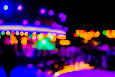 Defocused image of illuminated lights at night