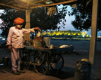 Man preparing tea at stall