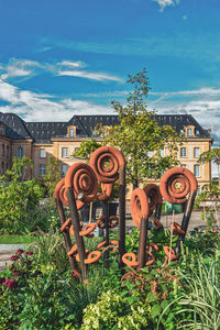 View of plants outside house against sky