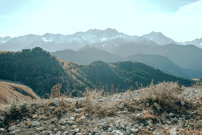 Scenic view of landscape and mountains against sky