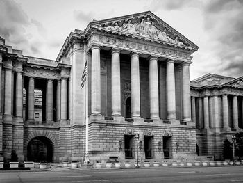 Low angle view of historical building against cloudy sky