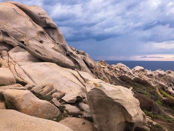 Rock formation on land against sky