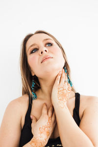 Portrait of woman against white background