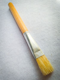 High angle view of paintbrushes on table