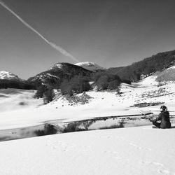 Scenic view of snowcapped mountains against clear sky