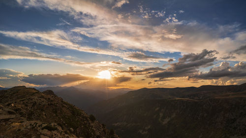 Scenic view of mountains against sky during sunset