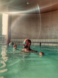 High angle view of men swimming in pool. garda lake.