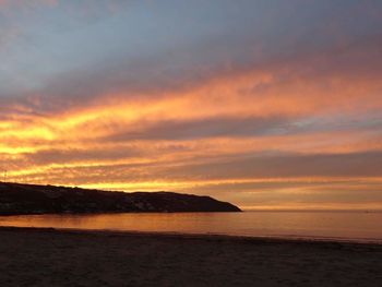 Scenic view of dramatic sky over sea