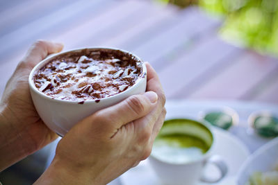 Close-up of hand holding drink