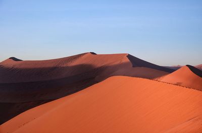 Scenic view of desert against clear sky