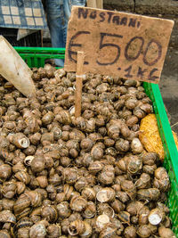 Low section of man for sale at market stall