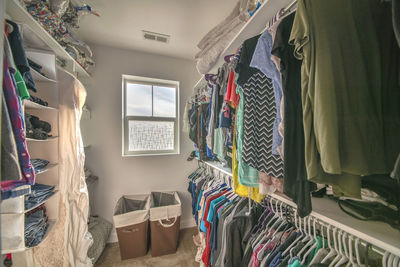 Row of clothes hanging in rack