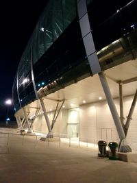 Illuminated modern building against sky at night