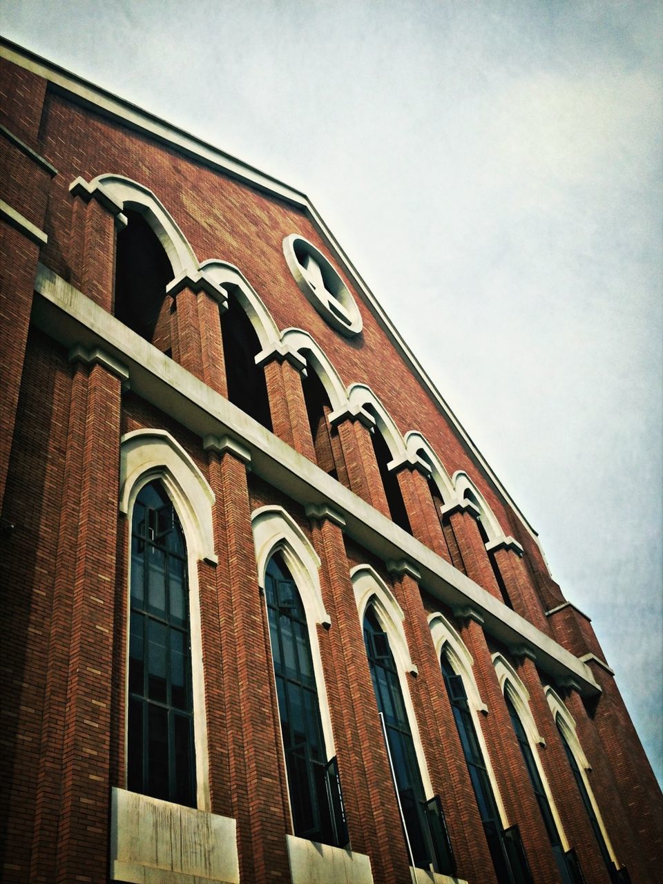 architecture, built structure, low angle view, building exterior, sky, window, building, arch, outdoors, day, no people, residential building, residential structure, cloud - sky, facade, house, old, high section, exterior, cloud