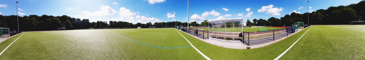 Panoramic view of soccer field against sky