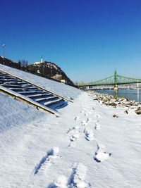 View of bridge against clear blue sky