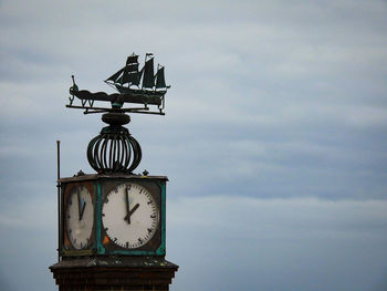 Low angle view of clock tower against sky