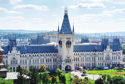 Buildings in city against sky