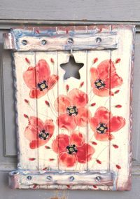 Close-up of red berries on white wall