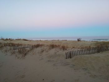 Scenic view of beach against clear sky