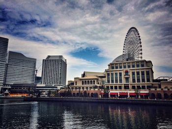 City buildings against cloudy sky