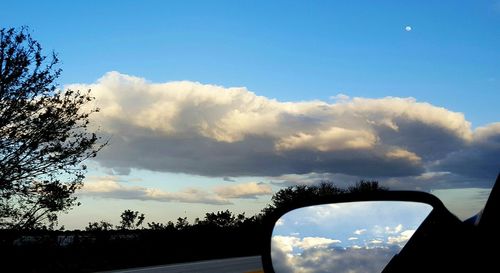 Scenic view of landscape against cloudy sky