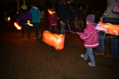 View of illuminated people at night