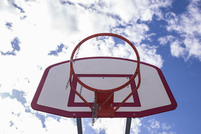 Low angle view of basketball hoop against sky during sunny day