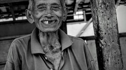 Portrait of man standing outdoors