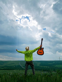 Full length of man on field against sky